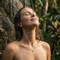 Thumbnail for Crystal Flower necklace worn under shower — dainty waterproof signature pendant with brilliant zircon clarity