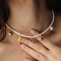Thumbnail for Summer Initial Necklace featuring seashell and ocean-inspired charms by Brother & Sisters, perfect for beachy elegance.