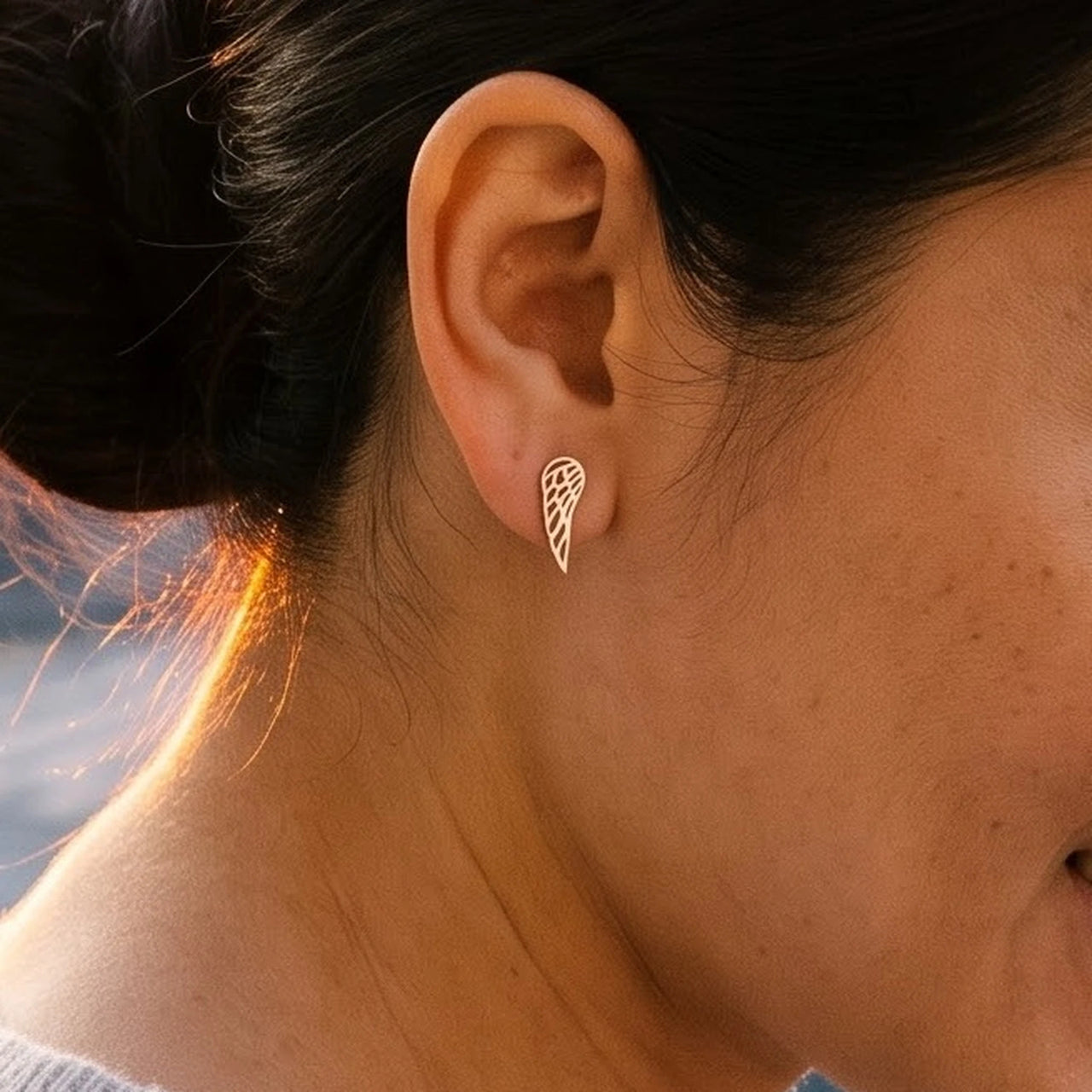 The rose gold stud earrings worn, close-up | SKU: 42008-rose-gold