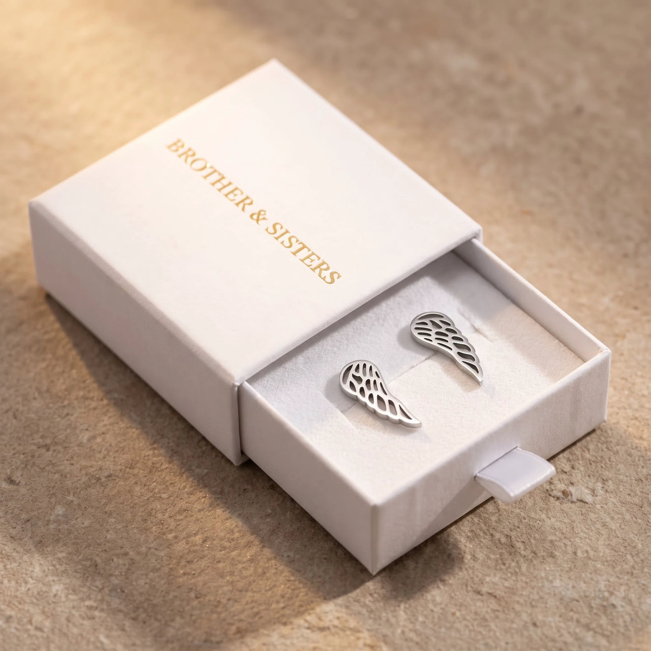 The silver stud earrings in the Brother & Sisters gift box | SKU: 42008-silver