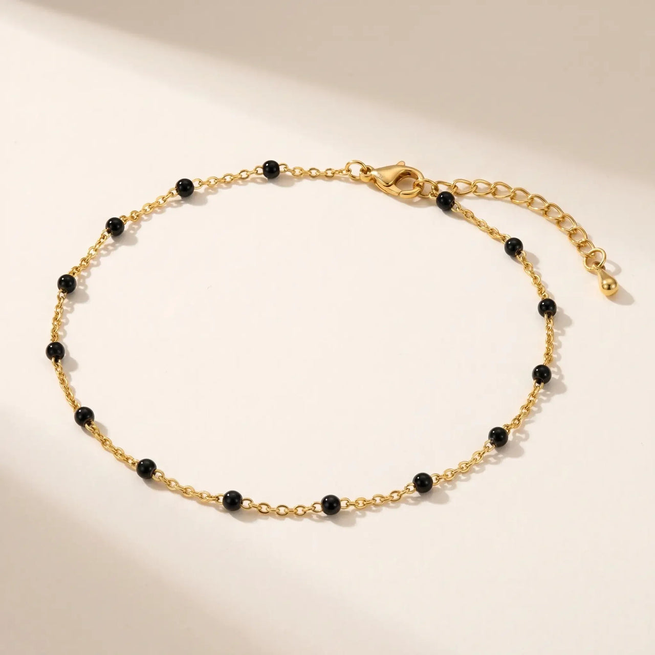 Gold & Onyx Bead Anklet featuring glossy black enamel beads and delicate gold chain by Brother & Sisters.