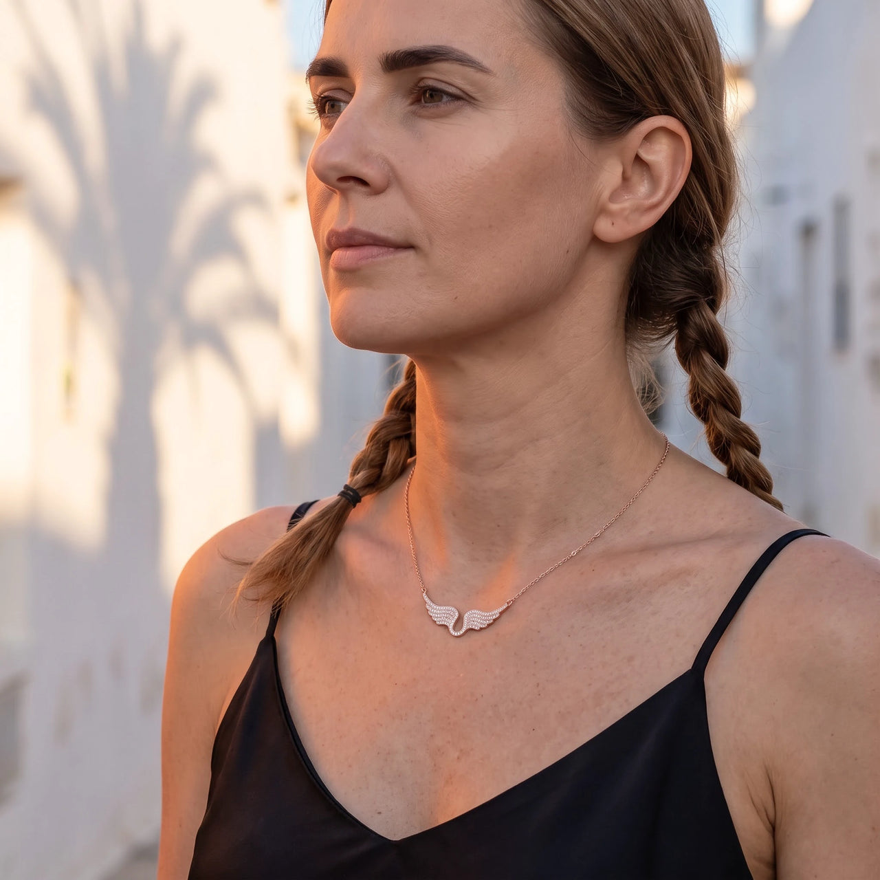 Profile view of a woman wearing the rose gold necklace | SKU: 42002-rose-gold