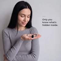 Thumbnail for Woman holding the silver cushion-cut bracelet in her palm, its plaque plain black: only you know what's hidden inside | SKU: TPH-CUSB-SILVER