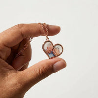 Thumbnail for Rose gold heart pendant held between two fingers, real small size, grandparents' photo inside | SKU: TPH-HRTN-ROSEGOLD