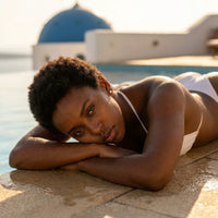 Thumbnail for Solitaire Crystal Studs in Gold, worn by a pool in Santorini | SKU: 41010-gold