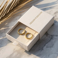 Thumbnail for Tiny Huggie Hoops in Gold, in the gift box | SKU: 41002-gold